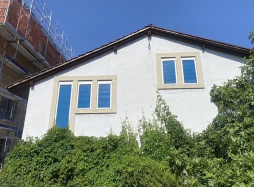 Neighbouring white building beside the project